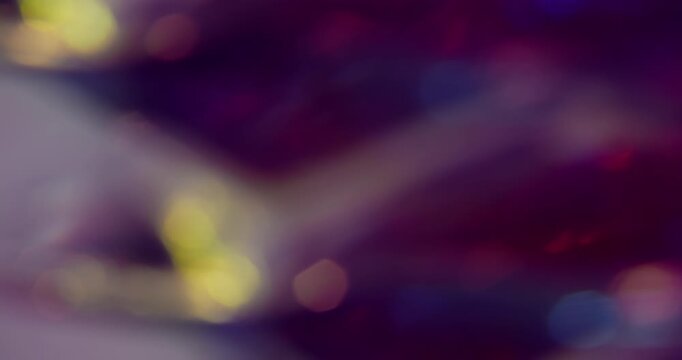 Blur bright glare. Neon glimmer art. Pink purple blue colorful lens flare shiny rainbow gleam kaleidoscope on light abstract bokeh background.