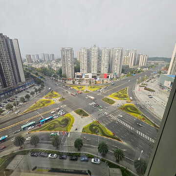 Leshan cityscape with high-rise buildings and roads. View of Leshan, Sichuan, China, featuring high-rise residential buildings and roads photographed from a hotel.