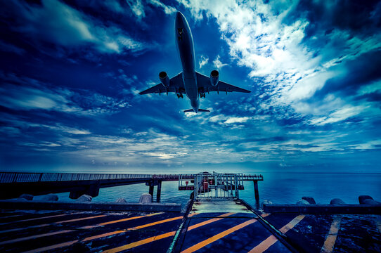 Airplane Low Approach Over Shimojishima Airport Runway Pier