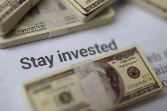 Stay Invested Message with Money for Long Term Investment Strategy