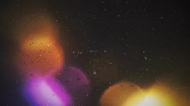 Looping texture dark grunge overlay low framerate stop motion concept. Abstract cosmic background with vintage scratches and colorful light effects for creative design