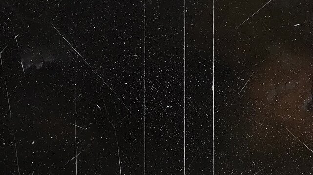 Abstract black and white textured background with scratches and speckled details for design and art
