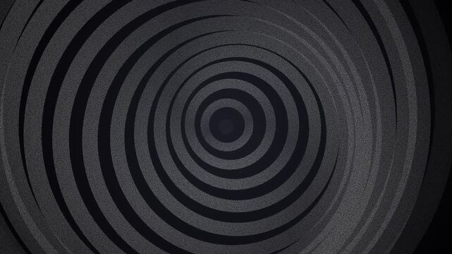 Concentric circular ripples forming a dark and minimalist geometric pattern