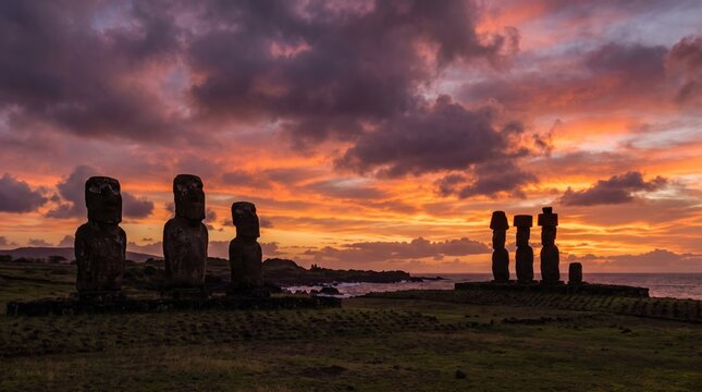 Sunset over Moai statues on Easter Island Chile