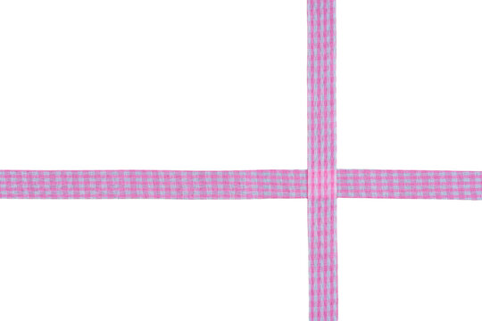 Intersecting pink and white gingham checkered cloth ribbon crossing perpendicularly isolated on transparent background for crafting