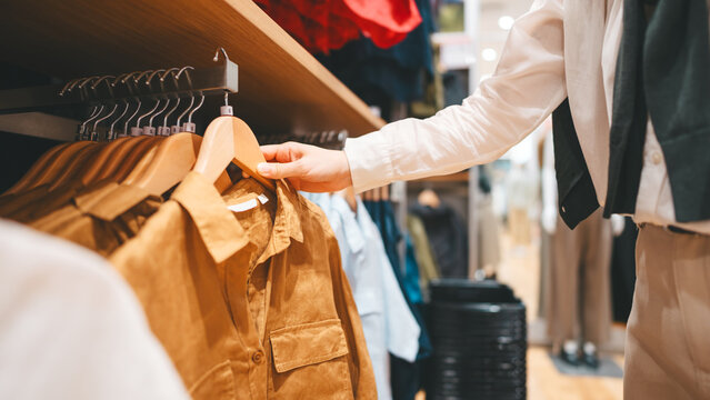 Happy asian woman shopping clothes in fashion shoping mall