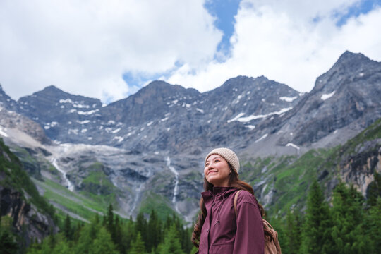 Portrait image of a woman with mountain range in summertime, Chengdu, China