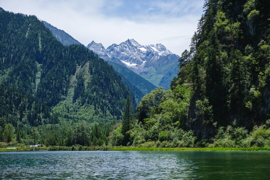 Landscape of the lake and greenery forest with four girls mountain range in Bipenggou, Chengdu China