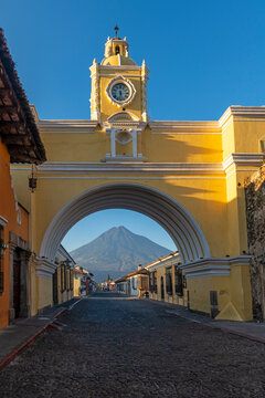 Santa Catalina arch and Agua Volcano sunrise, Antigua, Guatemala.
