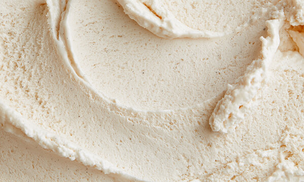 a creamy close up of vanila bean ice cream flecks of vanilla bean are visible