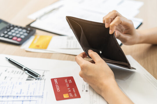 Debt financial concept, stressed problem asian woman hand open empty wallet, purse not have budget of money to pay no have credit card, not able payment bill, loan or expense with bank, bankruptcy.