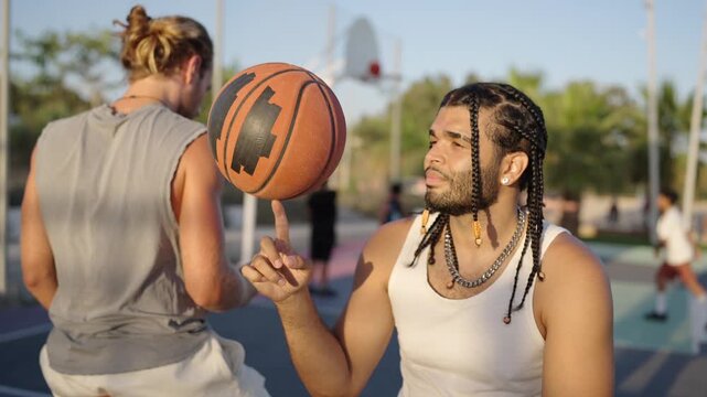 Talented basketball player spinning ball on finger