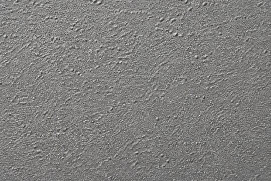 Textured plaster ceiling with bumpy finish closeup