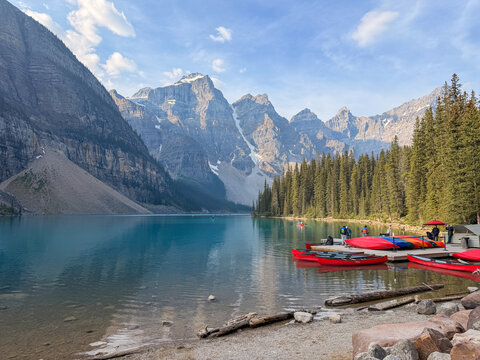 Red canoes docked at Moraine Lake with Valley of the Ten Peaks, Alberta