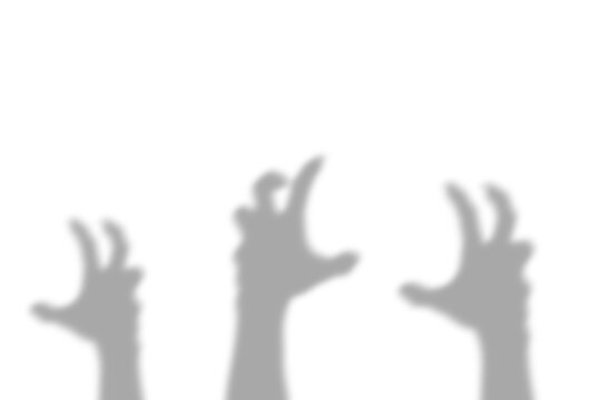A dark silhouette of three reaching human hands casting a spooky shadow effect on a white surface presented as an isolated on transparent background