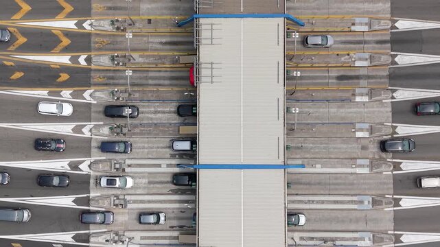 Aerial perspective of vehicles moving through multiple toll lanes at Milano Sud, providing useful visuals for transportation, logistics, infrastructure and urban mobility stories.