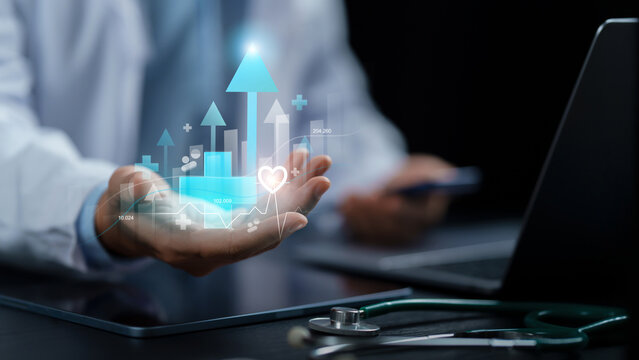 Doctor holding glowing growth arrow chart with cross and heart icons for medical healthcare investment, medical business success, insurance growth. healthcare analytics and financial growth.