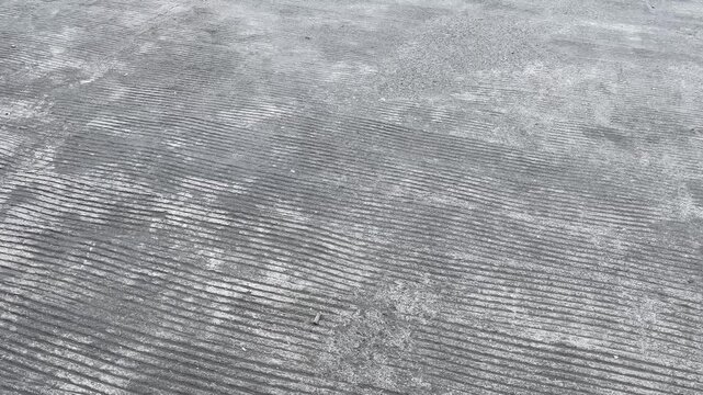 Brushed concrete surface texture on new road construction site