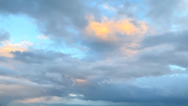 Storm clouds forming wide view above distant mountain ridges in Svaneti, Georgia, showing changing alpine weather, sunset cloud layers, regional climate conditions, and outdoor travel planning.