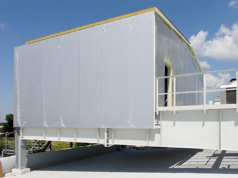 Modern warehouse construction with insulated sandwich panels and steel framework