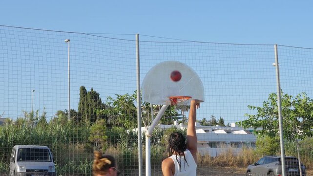 Young man scoring points during basketball game