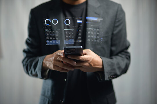 Businessman Using Smartphone with Digital Data Overlay in Modern Office Environment