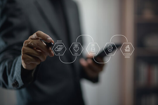Business Professional Using Digital Tablet with Health and Medical Icons Overlay