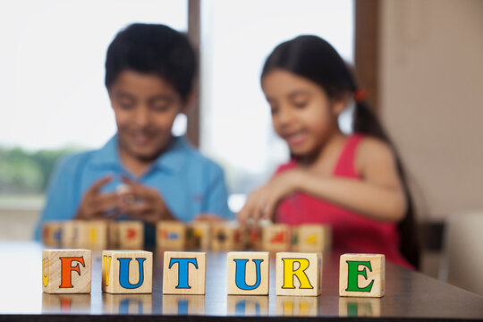 Boy and girl playing with building blocks