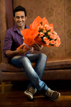 Portrait of a man with a bouquet of flowers