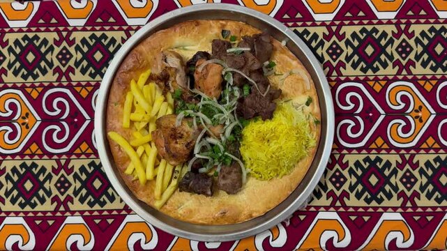 Traditional shashlik mixed platter with rice, fries, and flatbread