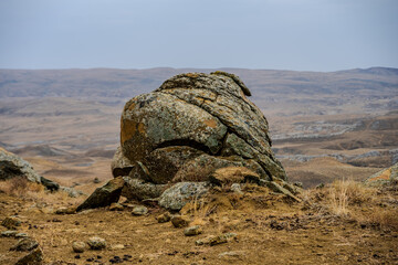 Large weathered rock in the Mangystau District landscape © Emad Aljumah