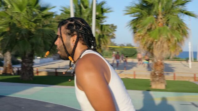 Athletic man scoring a perfect basketball shot outdoors
