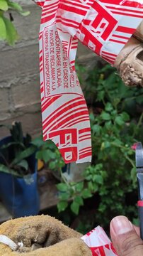 Cutting Fragile Packaging Tape with Small Pliers Tool