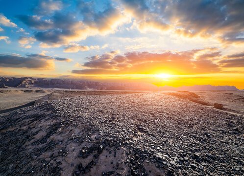 Scenic sunset light shining over vast yardang landforms and desert landscapes in Dahaidao, Gobi Desert, Xinjiang, China