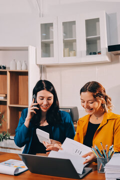 Portrait of military mother helping teen daughter with homework and eating lunch