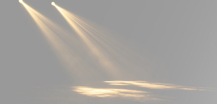 Abstract golden spotlight shining diagonally with luminous stage beams and warm theatrical light ray