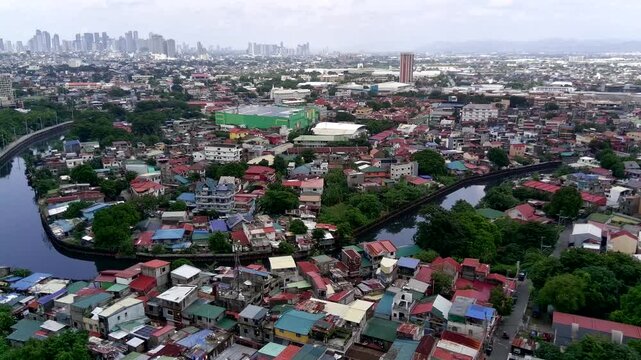 Tracking Shot Wide Establishing Shot of Taguig City in Metro Manila with Landscape of Houses and Buildings and a River Going Through the Land