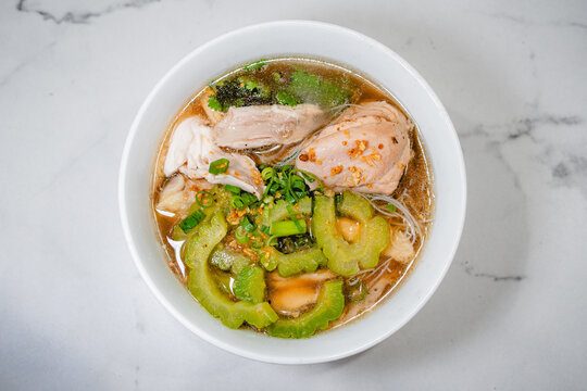 Top of view, Asian Chicken Noodle Soup with Bitter Melon in a Bowlg