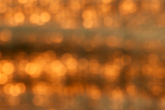 Featuring glowing orange and gold light spots. The soft, dreamy atmosphere