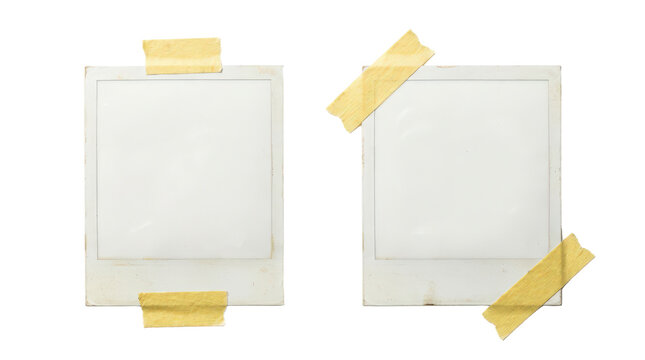 Two old empty polaroid photo frames with adhesive tape isolated on transparent background
