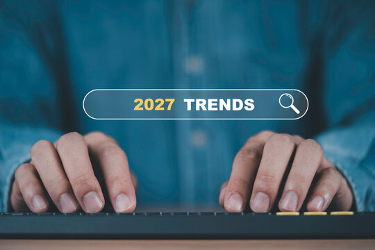 2027 trends search concept with person using a computer to research future business trends, market outlook, technology innovation, forecasting and strategic planning for upcoming opportunities.