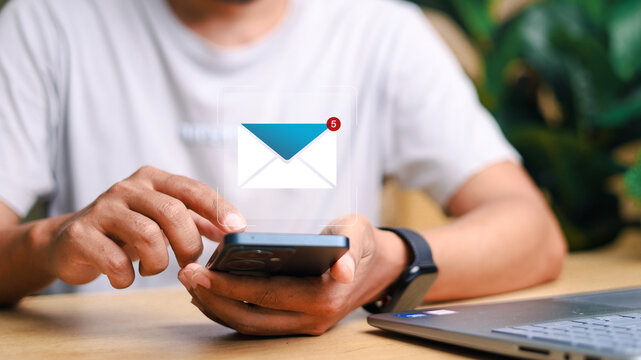 Email notification icon over laptop and tablet. Concept of business communication, inbox alert, workflow, and digital messaging.