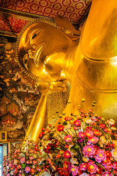 The Big golden Reclining Buddha within Wat Pho is the important in Bangkok, Thailand
