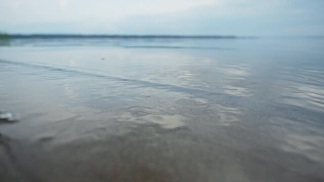 Surface of the calm river during overcast day