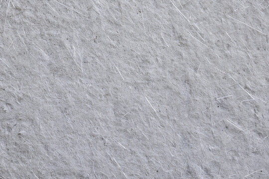 White fiberglass surface texture background with visible interwoven glass fibers