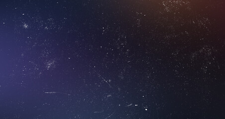 Dark space galaxy style background with dust scratch textures and warm orange lens flare light leak for retro poster. © Neon Flow