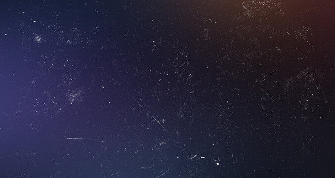 Dark space galaxy style background with dust scratch textures and warm orange lens flare light leak for retro poster.
