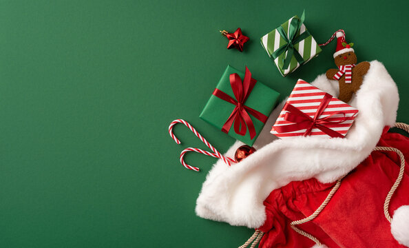 Merry Christmas and happy New Year Santa Claus presents in red and green festive stocking