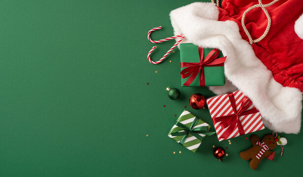 Merry Christmas and Happy New Year Santa Claus presents with wrapped gifts, candy canes and festive decorations