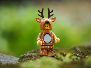 Naklejka premium Indonesia - May 9, 2023 : Toy photography concept at outdoor with unfocus green grass. Background is blurred.